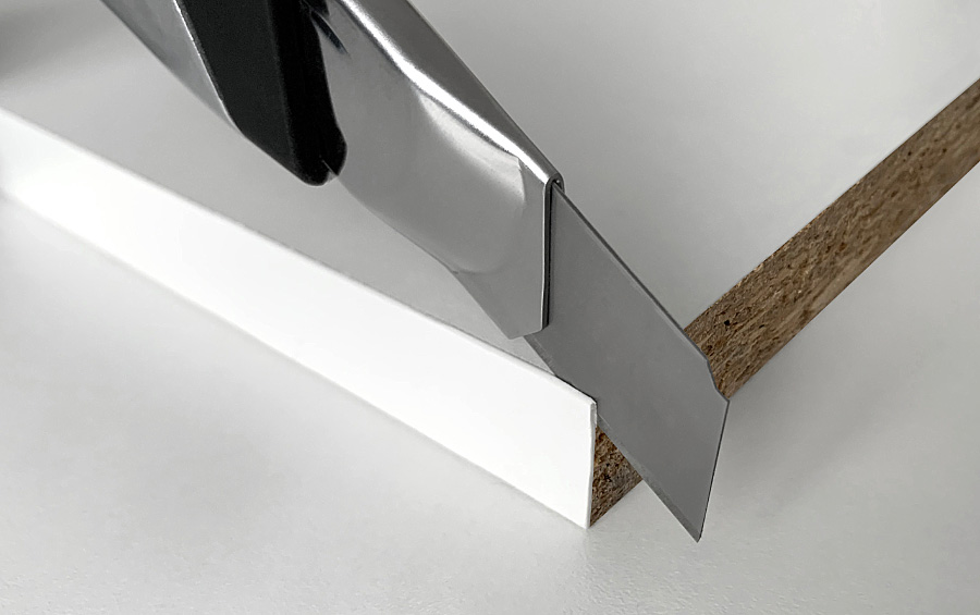 Cut ABS edging from melamine-faced chipboard (MFC)